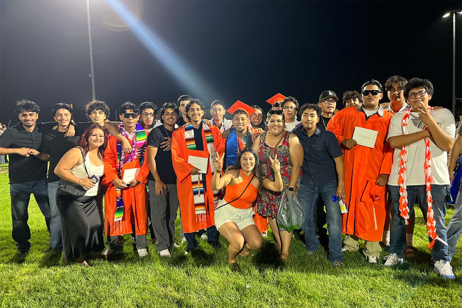 Group photograph of young adults graduating from high school